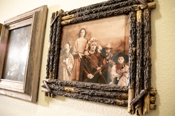 Framed vintage photo of people in costume.