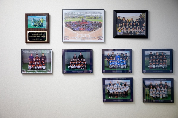 Wall of sports team photos and plaques